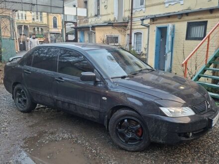 Чорний Міцубісі Lancer, об'ємом двигуна 1.6 л та пробігом 290 тис. км за 3800 $, фото 1 на Automoto.ua