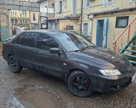 Черный Мицубиси Лансер, объемом двигателя 1.6 л и пробегом 290 тыс. км за 3800 $, фото 1 на Automoto.ua