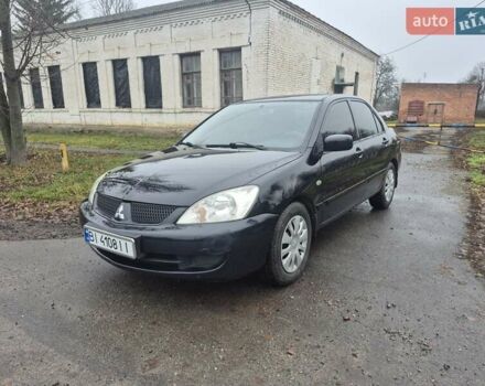 Черный Мицубиси Лансер, объемом двигателя 1.58 л и пробегом 280 тыс. км за 3200 $, фото 1 на Automoto.ua