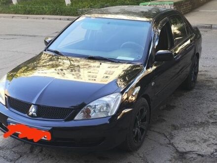 Мицубиси Лансер 2005 в Южноукраинске на Automoto.ua Черный Мицубиси Лансер, объемом двигателя 1.6 л и пробегом 350 тыс. км за 3099 $, фото 1 на Automoto.ua