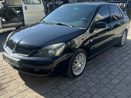 Чорний Міцубісі Lancer, об'ємом двигуна 1.58 л та пробігом 250 тис. км за 5000 $, фото 1 на Automoto.ua