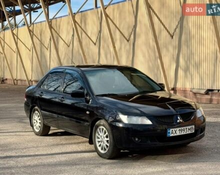 Черный Мицубиси Лансер, объемом двигателя 1.58 л и пробегом 270 тыс. км за 3900 $, фото 1 на Automoto.ua