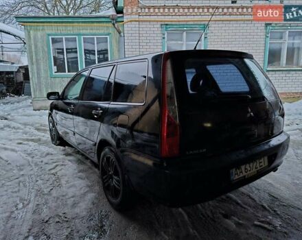 Черный Мицубиси Лансер, объемом двигателя 1.6 л и пробегом 200 тыс. км за 2700 $, фото 1 на Automoto.ua