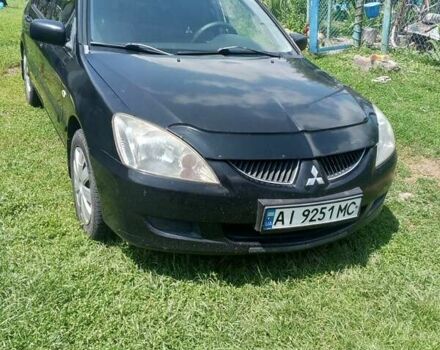 Чорний Міцубісі Lancer, об'ємом двигуна 1.58 л та пробігом 390 тис. км за 4200 $, фото 1 на Automoto.ua