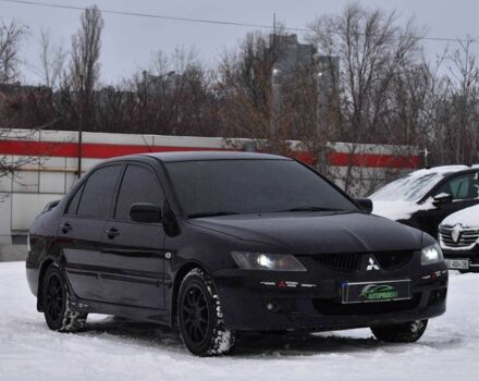 Черный Мицубиси Лансер, объемом двигателя 2 л и пробегом 266 тыс. км за 4450 $, фото 1 на Automoto.ua