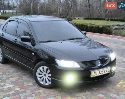 Чорний Міцубісі Lancer, об'ємом двигуна 1.58 л та пробігом 263 тис. км за 4500 $, фото 1 на Automoto.ua