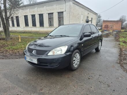 Черный Мицубиси Лансер, объемом двигателя 1.6 л и пробегом 280 тыс. км за 3200 $, фото 1 на Automoto.ua