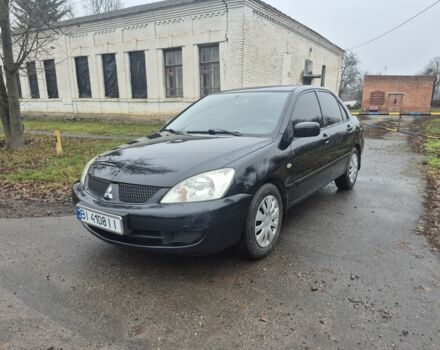 Черный Мицубиси Лансер, объемом двигателя 1.6 л и пробегом 280 тыс. км за 3200 $, фото 1 на Automoto.ua