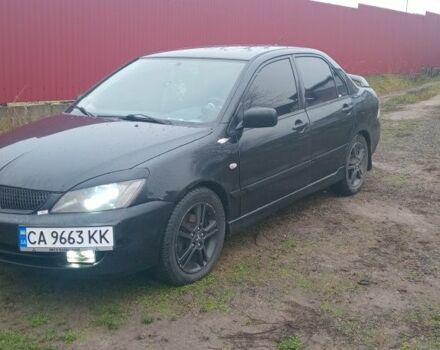 Чорний Міцубісі Lancer, об'ємом двигуна 2 л та пробігом 270 тис. км за 3200 $, фото 1 на Automoto.ua