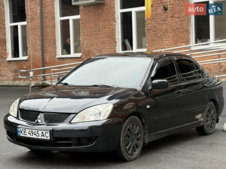 Черный Мицубиси Лансер, объемом двигателя 1.58 л и пробегом 198 тыс. км за 3700 $, фото 1 на Automoto.ua