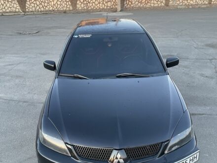 Черный Мицубиси Лансер, объемом двигателя 2 л и пробегом 50 тыс. км за 4500 $, фото 1 на Automoto.ua