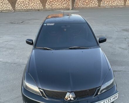 Черный Мицубиси Лансер, объемом двигателя 2 л и пробегом 50 тыс. км за 4500 $, фото 1 на Automoto.ua