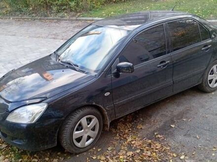 Чорний Міцубісі Lancer, об'ємом двигуна 1.6 л та пробігом 211 тис. км за 3700 $, фото 1 на Automoto.ua