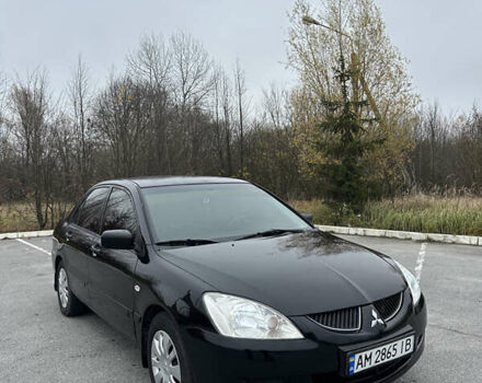 Черный Мицубиси Лансер, объемом двигателя 1.6 л и пробегом 200 тыс. км за 3499 $, фото 1 на Automoto.ua