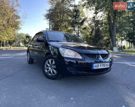 Черный Мицубиси Лансер, объемом двигателя 1.6 л и пробегом 261 тыс. км за 4100 $, фото 1 на Automoto.ua