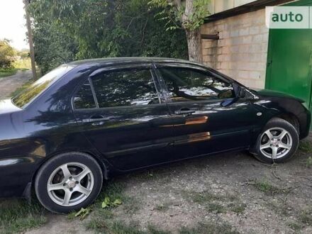 Чорний Міцубісі Lancer, об'ємом двигуна 1.6 л та пробігом 313 тис. км за 5000 $, фото 1 на Automoto.ua