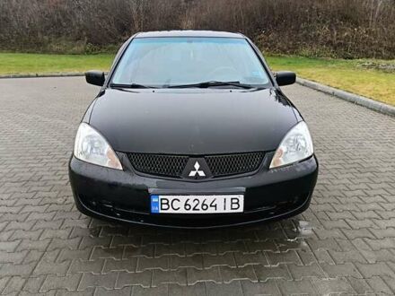 Черный Мицубиси Лансер, объемом двигателя 1.58 л и пробегом 336 тыс. км за 2600 $, фото 1 на Automoto.ua