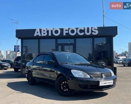 Чорний Міцубісі Lancer, об'ємом двигуна 1.58 л та пробігом 310 тис. км за 5690 $, фото 1 на Automoto.ua