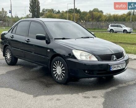 Черный Мицубиси Лансер, объемом двигателя 1.6 л и пробегом 298 тыс. км за 3800 $, фото 1 на Automoto.ua
