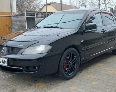 Черный Мицубиси Лансер, объемом двигателя 2 л и пробегом 231 тыс. км за 4350 $, фото 1 на Automoto.ua