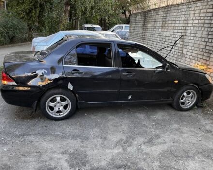 Чорний Міцубісі Lancer, об'ємом двигуна 1.6 л та пробігом 172 тис. км за 2000 $, фото 1 на Automoto.ua