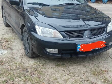 Мицубиси Лансер 2005 в Днепре (Днепропетровске) на Automoto.ua Черный Мицубиси Лансер, объемом двигателя 1.6 л и пробегом 250 тыс. км за 5500 $, фото 1 на Automoto.ua
