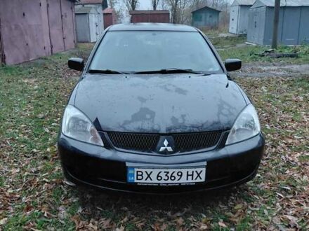 Черный Мицубиси Лансер, объемом двигателя 1.58 л и пробегом 238 тыс. км за 3500 $, фото 1 на Automoto.ua