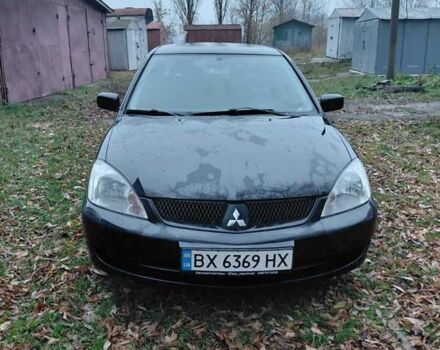 Черный Мицубиси Лансер, объемом двигателя 1.58 л и пробегом 238 тыс. км за 3500 $, фото 1 на Automoto.ua