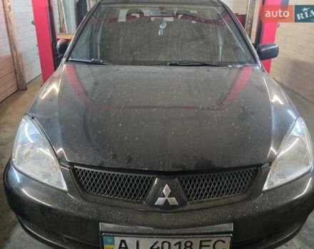 Черный Мицубиси Лансер, объемом двигателя 1.6 л и пробегом 289 тыс. км за 2500 $, фото 1 на Automoto.ua