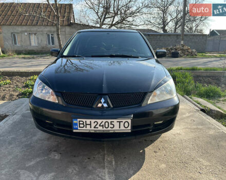 Чорний Міцубісі Lancer, об'ємом двигуна 1.58 л та пробігом 203 тис. км за 4200 $, фото 1 на Automoto.ua