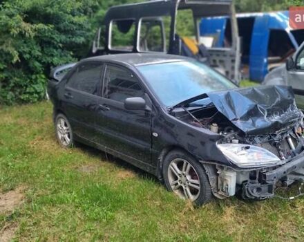 Чорний Міцубісі Lancer, об'ємом двигуна 2 л та пробігом 257 тис. км за 1300 $, фото 1 на Automoto.ua