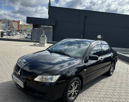 Чорний Міцубісі Lancer, об'ємом двигуна 1.58 л та пробігом 320 тис. км за 3500 $, фото 1 на Automoto.ua