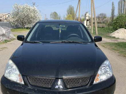 Чорний Міцубісі Lancer, об'ємом двигуна 1.58 л та пробігом 165 тис. км за 4000 $, фото 1 на Automoto.ua