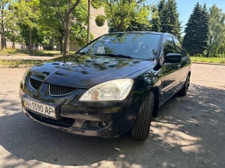 Мицубиси Лансер 2005 в Киеве на Automoto.ua Черный Мицубиси Лансер, объемом двигателя 1.6 л и пробегом 176 тыс. км за 4000 $, фото 1 на Automoto.ua