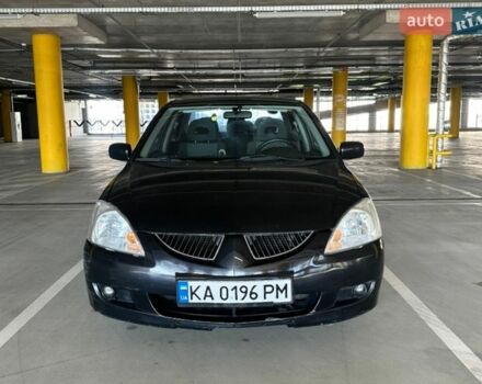 Черный Мицубиси Лансер, объемом двигателя 1.58 л и пробегом 183 тыс. км за 3900 $, фото 1 на Automoto.ua