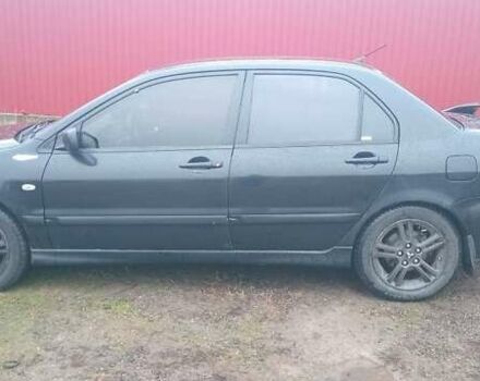 Черный Мицубиси Лансер, объемом двигателя 2 л и пробегом 270 тыс. км за 3200 $, фото 1 на Automoto.ua