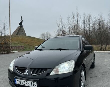 Черный Мицубиси Лансер, объемом двигателя 1.6 л и пробегом 200 тыс. км за 3500 $, фото 1 на Automoto.ua