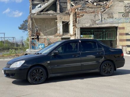 Чорний Міцубісі Lancer, об'ємом двигуна 0.16 л та пробігом 294 тис. км за 4199 $, фото 1 на Automoto.ua