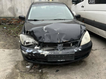 Чорний Міцубісі Lancer, об'ємом двигуна 1.58 л та пробігом 360 тис. км за 1500 $, фото 1 на Automoto.ua