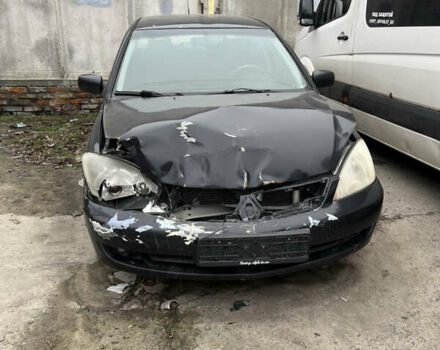 Черный Мицубиси Лансер, объемом двигателя 1.58 л и пробегом 360 тыс. км за 1500 $, фото 1 на Automoto.ua