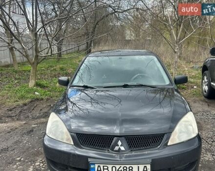 Черный Мицубиси Лансер, объемом двигателя 1.6 л и пробегом 260 тыс. км за 3800 $, фото 1 на Automoto.ua