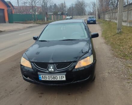 Черный Мицубиси Лансер, объемом двигателя 1.6 л и пробегом 313 тыс. км за 2450 $, фото 1 на Automoto.ua