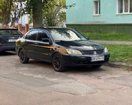 Чорний Міцубісі Lancer, об'ємом двигуна 1 л та пробігом 300 тис. км за 3500 $, фото 1 на Automoto.ua