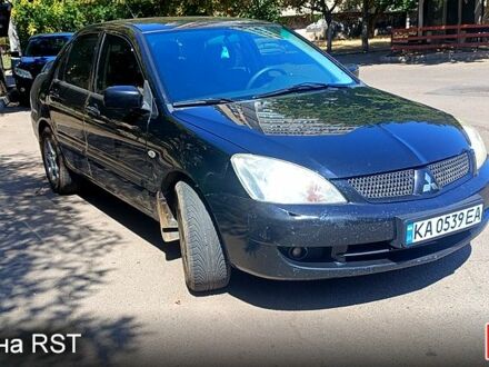 Черный Мицубиси Лансер, объемом двигателя 1.6 л и пробегом 238 тыс. км за 4300 $, фото 1 на Automoto.ua