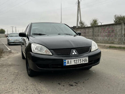 Черный Мицубиси Лансер, объемом двигателя 1.58 л и пробегом 230 тыс. км за 3350 $, фото 1 на Automoto.ua