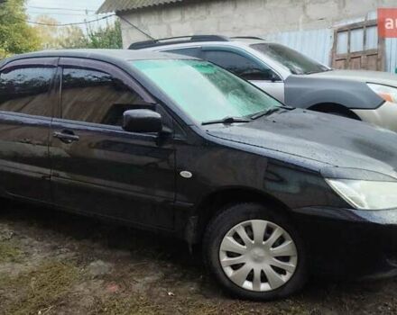 Чорний Міцубісі Lancer, об'ємом двигуна 1.58 л та пробігом 180 тис. км за 5000 $, фото 1 на Automoto.ua