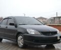 Чорний Міцубісі Lancer, об'ємом двигуна 2 л та пробігом 76 тис. км за 4800 $, фото 1 на Automoto.ua