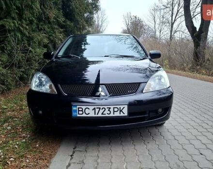 Черный Мицубиси Лансер, объемом двигателя 1.58 л и пробегом 246 тыс. км за 4200 $, фото 1 на Automoto.ua