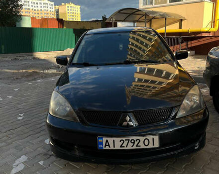 Чорний Міцубісі Lancer, об'ємом двигуна 2 л та пробігом 330 тис. км за 3700 $, фото 1 на Automoto.ua