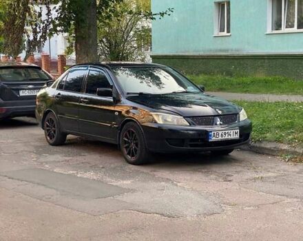 Чорний Міцубісі Lancer, об'ємом двигуна 1.58 л та пробігом 300 тис. км за 3500 $, фото 1 на Automoto.ua